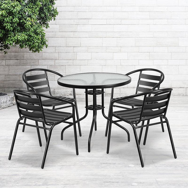 Flash Furniture 31.5'' Round Glass Metal Table with 4 Black Metal Aluminum Slat Stack Chairs - TLH-072RD-017CBK4-GG